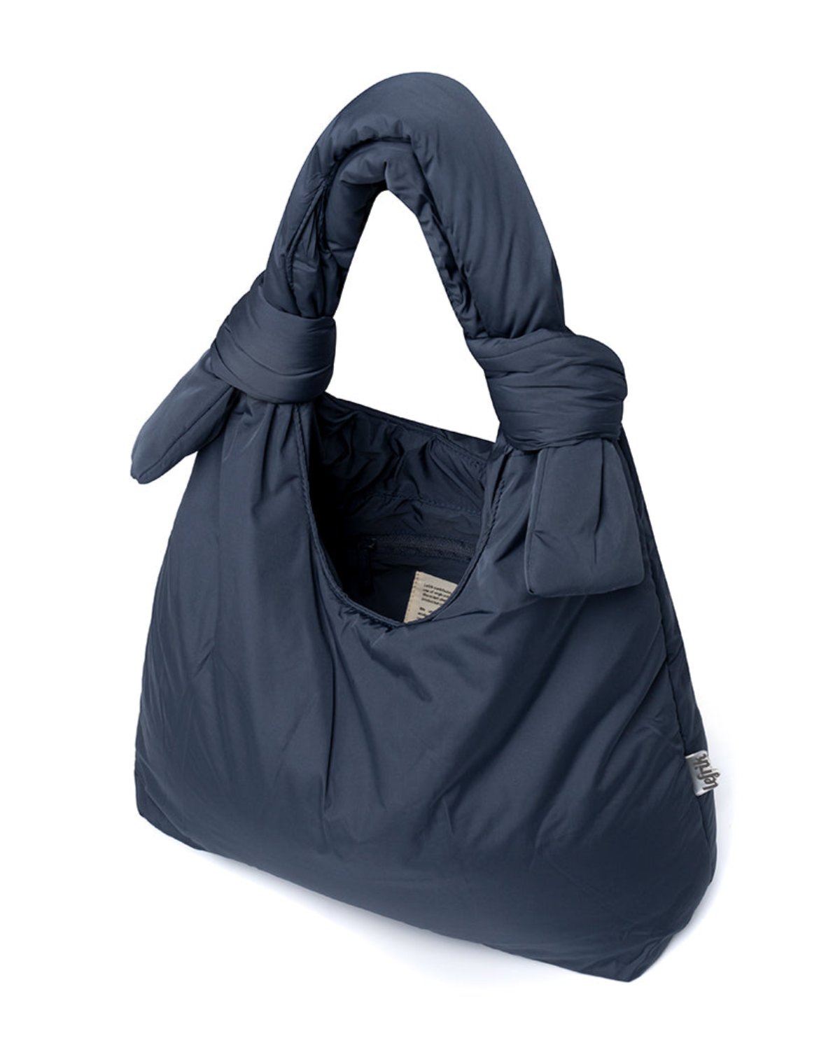 The jan-n-june BAG BIWA PUFFY REGULAR MAIBON is a dark blue, quilted bag with knotted handles, made from soft, vegan, recycled polyester and shown against a white background.
