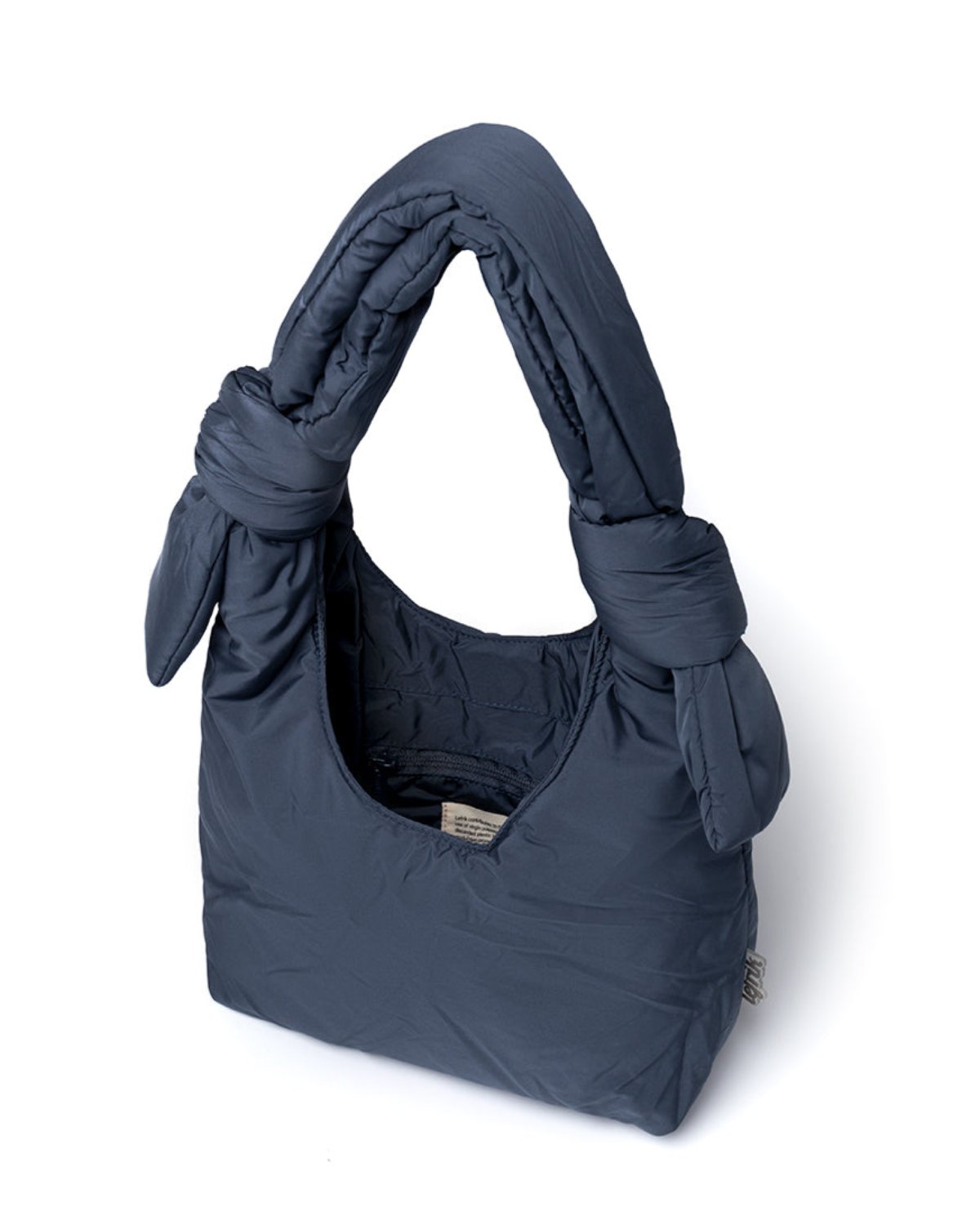 The jan-n-june BAG BIWA PUFFY MINI MAIBON is a dark blue, padded mini shoulder bag with thick knotted handles and a soft quilted RPET texture, displayed against a white background.