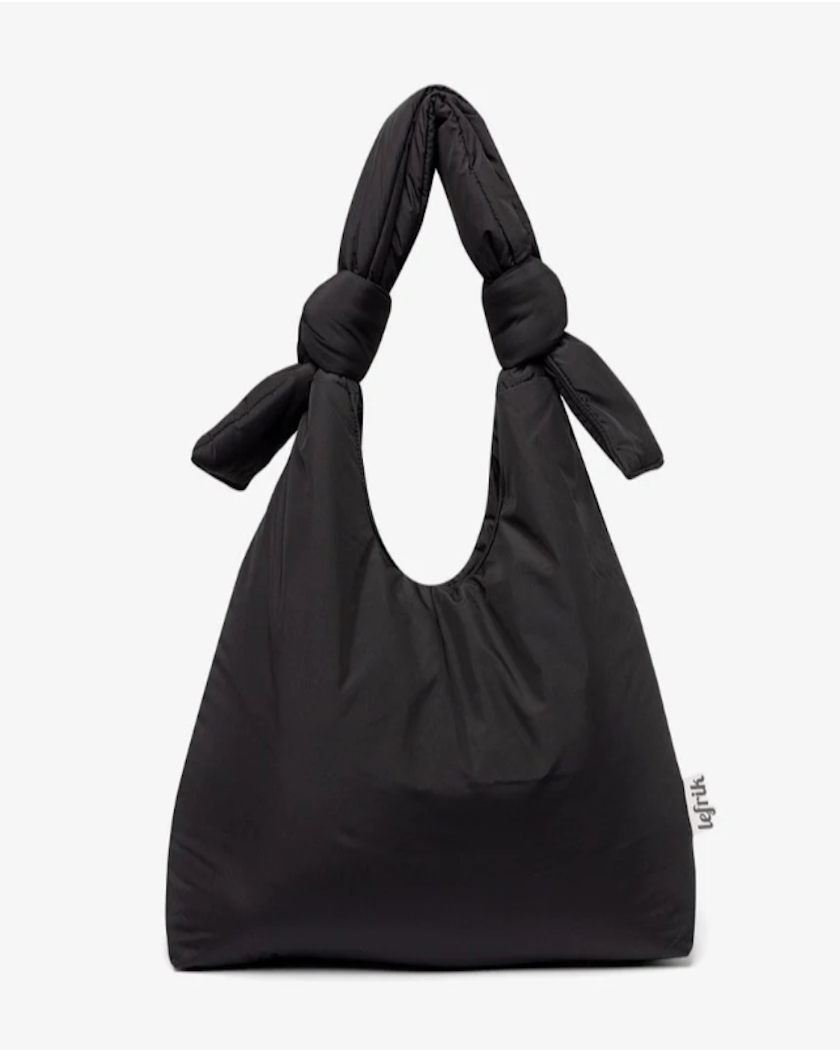 The BAG BIWA PUFFY REGULAR BLACK by jan-n-june is a black tote bag crafted from recycled plastic fabric, featuring soft material, two thick adjustable sliding knot handles, and a small right-side tag with the brand name.
