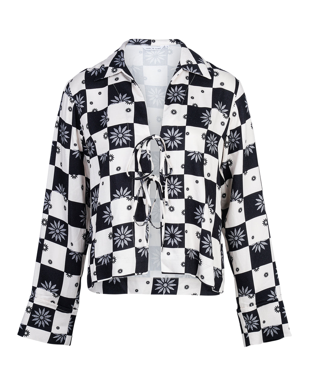 The TIE BLOUSE KALUZ FLORAL SQUARE PRINT by jan-n-june is a long-sleeve blouse with black and white checks, floral patterns, small dots, a lace-up front, and a collar.