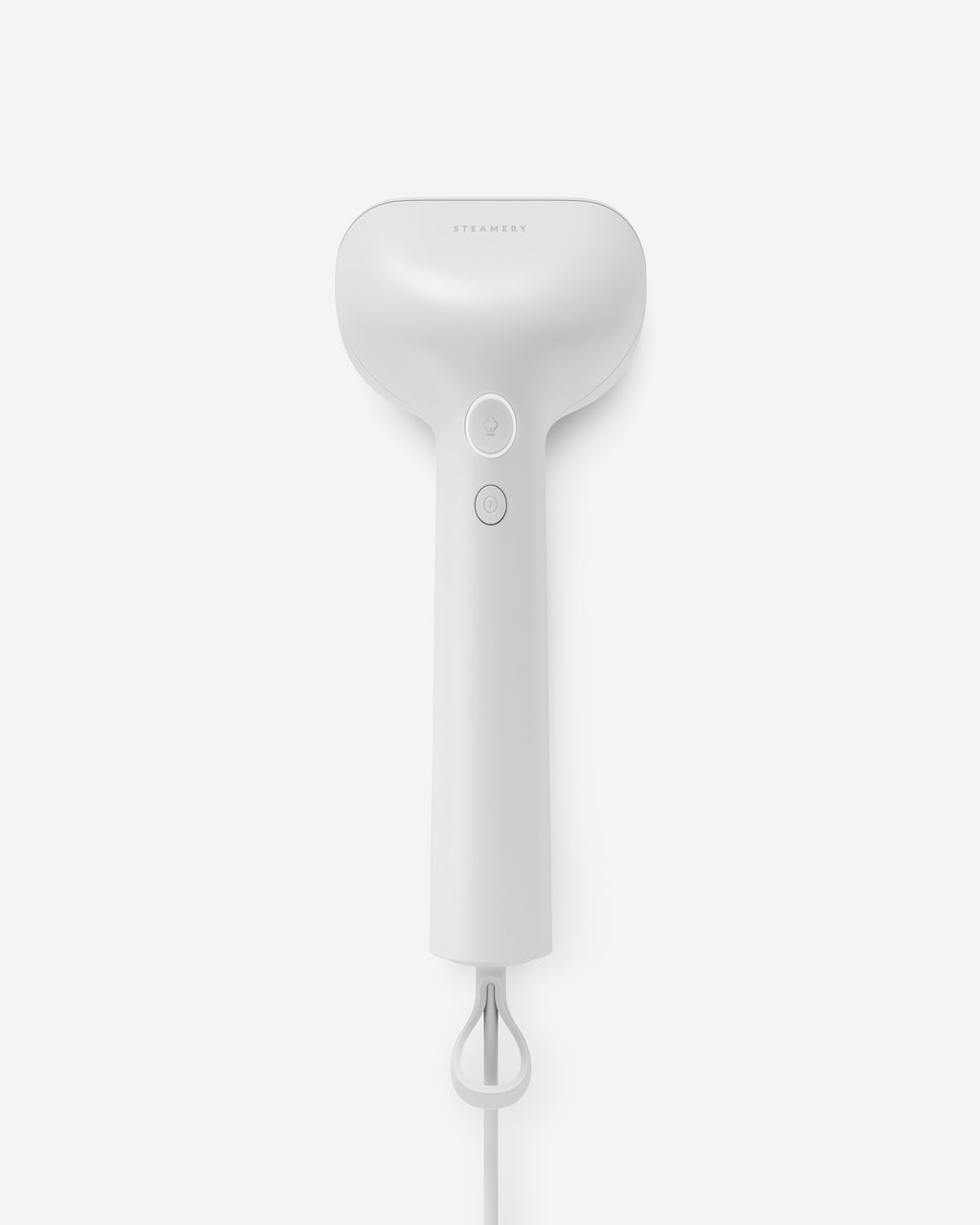 The jan-n-june STEAMERY CIRRUS X HANDHELD COTTON, a sleek white steamer with two buttons and visible power cord, highlights its minimalist, portable design against a light gray background.