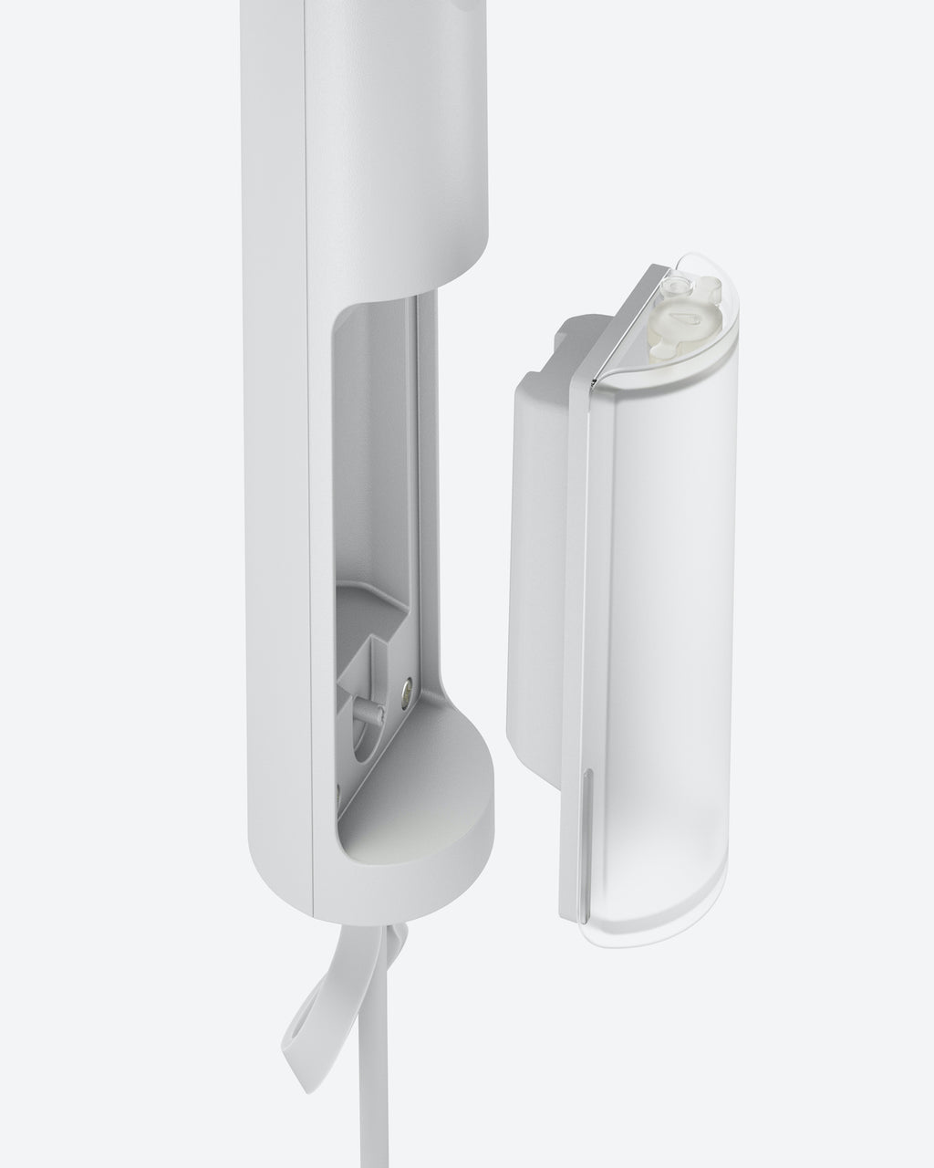 A close-up of the jan-n-june STEAMERY CIRRUS X HANDHELD COTTON shows its sleek, portable design with the removable container detached, revealing the easy-to-access compartment for effortless use and refilling.