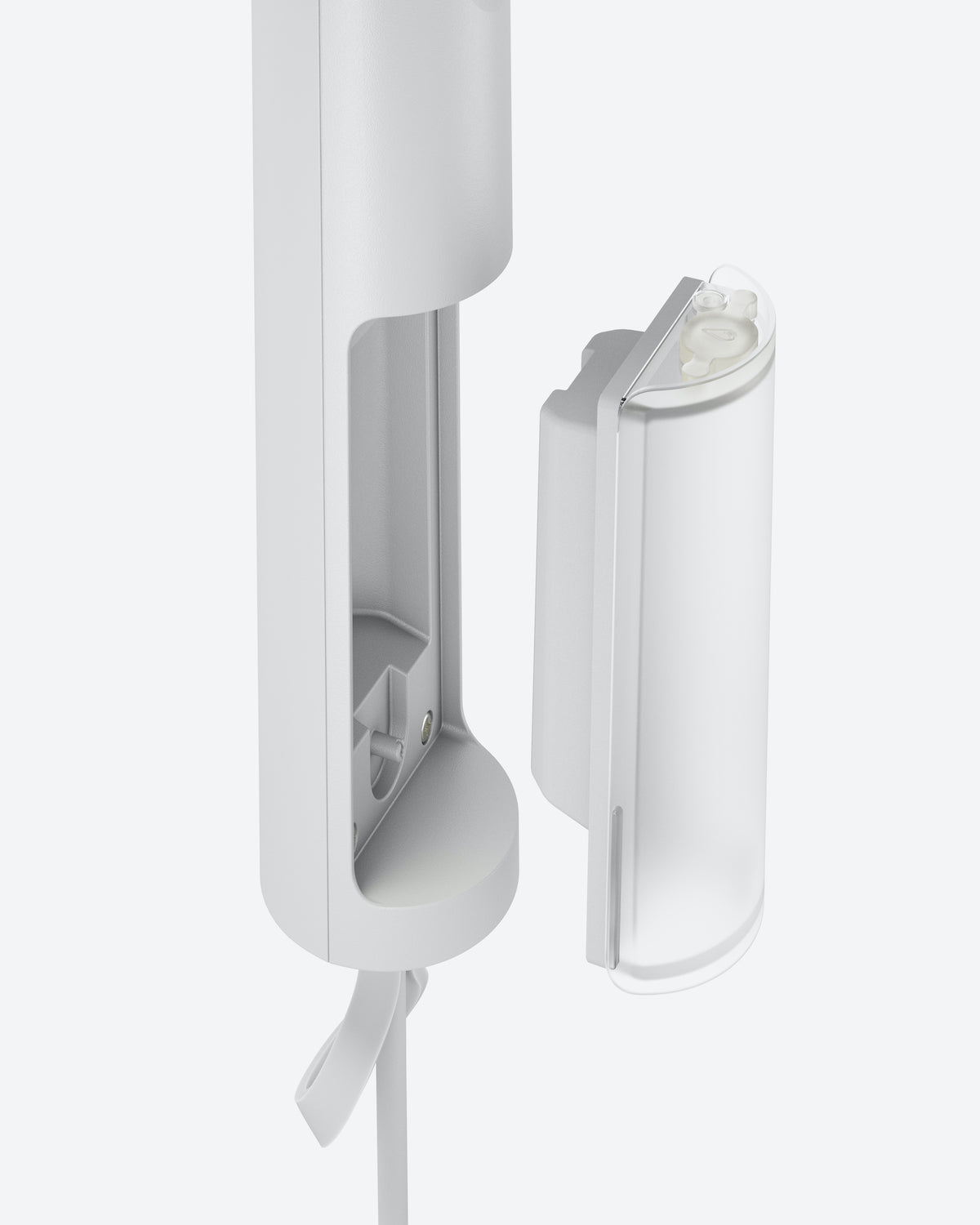 A close-up of the jan-n-june STEAMERY CIRRUS X HANDHELD COTTON shows its sleek, portable design with the removable container detached, revealing the easy-to-access compartment for effortless use and refilling.