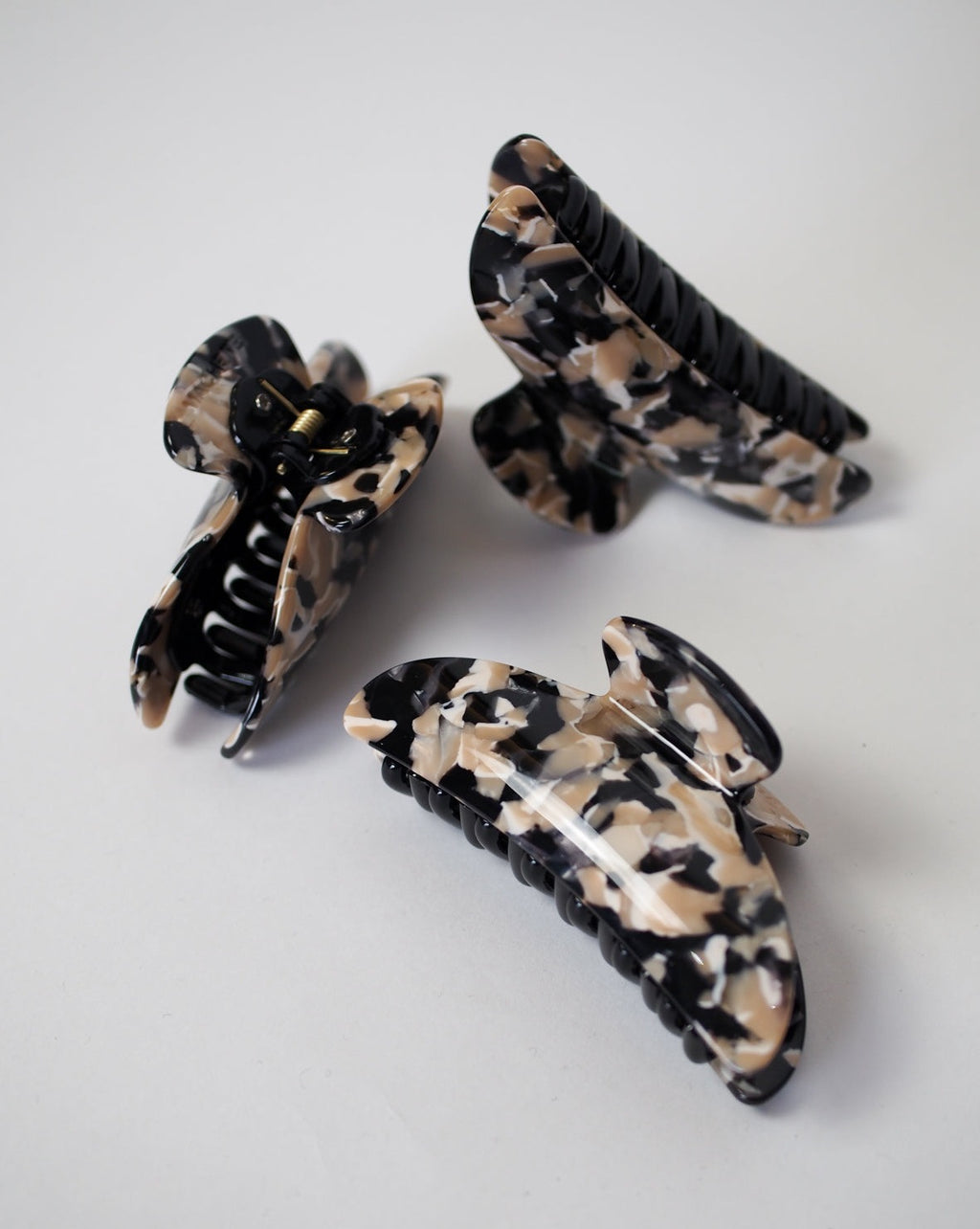 Three jan-n-june MIDI HEIRLOOM CLAW ABALONE hair claws, made from Italian acetate in double-walled designs, are displayed on a plain white surface.