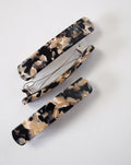 Two rectangular HEIRLOOM BARRETTE ABALONE hair clips by jan-n-june, crafted from Italian acetate in a marbled beige, black, and cream pattern, are shown on a white background—one closed, one open to reveal the clasp.