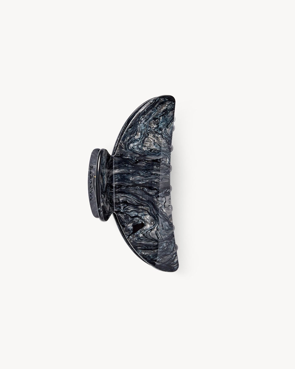 The jan-n-june MIDI HEIRLOOM CLAW OBSIDIAN is a marbled black and gray hair clip with a semi-circular, classy design, shown against a white background.