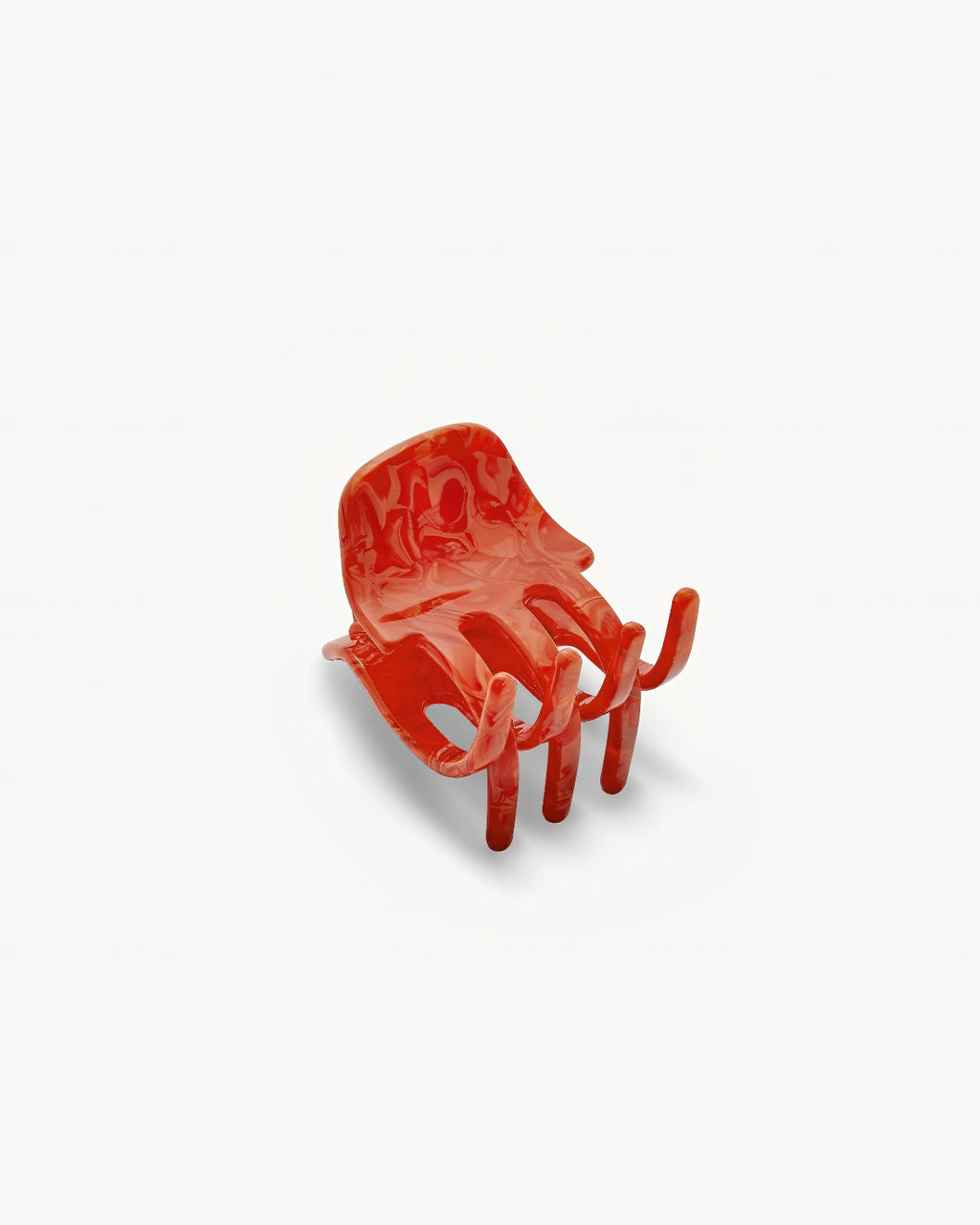 The MINI CLAW POPPY chair by jan-n-june is a bold red, Italian-handcrafted piece shaped like an open hand, featuring finger-like armrests and legs with a palm-shaped seat, displayed on a plain white background.
