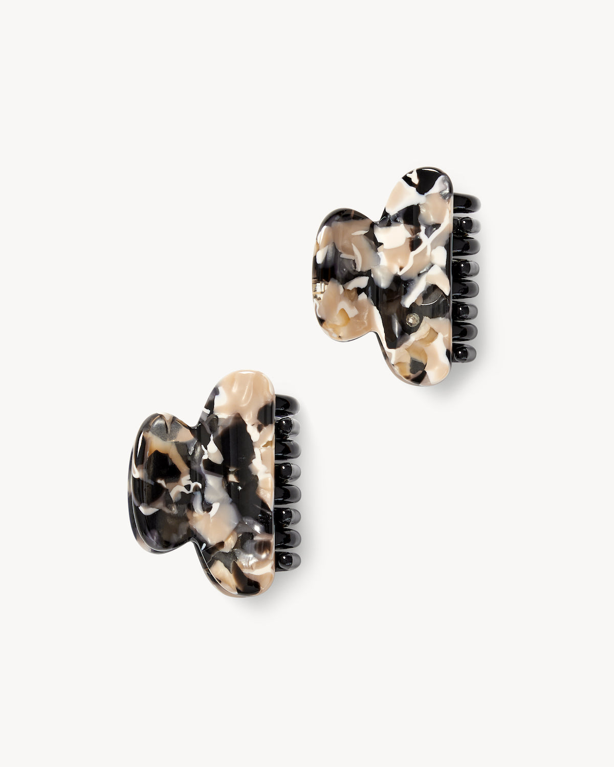 Two MINI HEIRLOOM CLIP ABALONE hair claw clips by jan-n-june, featuring a tortoiseshell look in black, beige, and cream, handcrafted in Italy for French chic flair. Displayed on a white background.