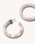 The MINI HOOPS PEACH SHELL by jan-n-june are round, open acetate mini hoop earrings with a marbled, pearly pink finish and silver-tone posts, shown against a plain white background.