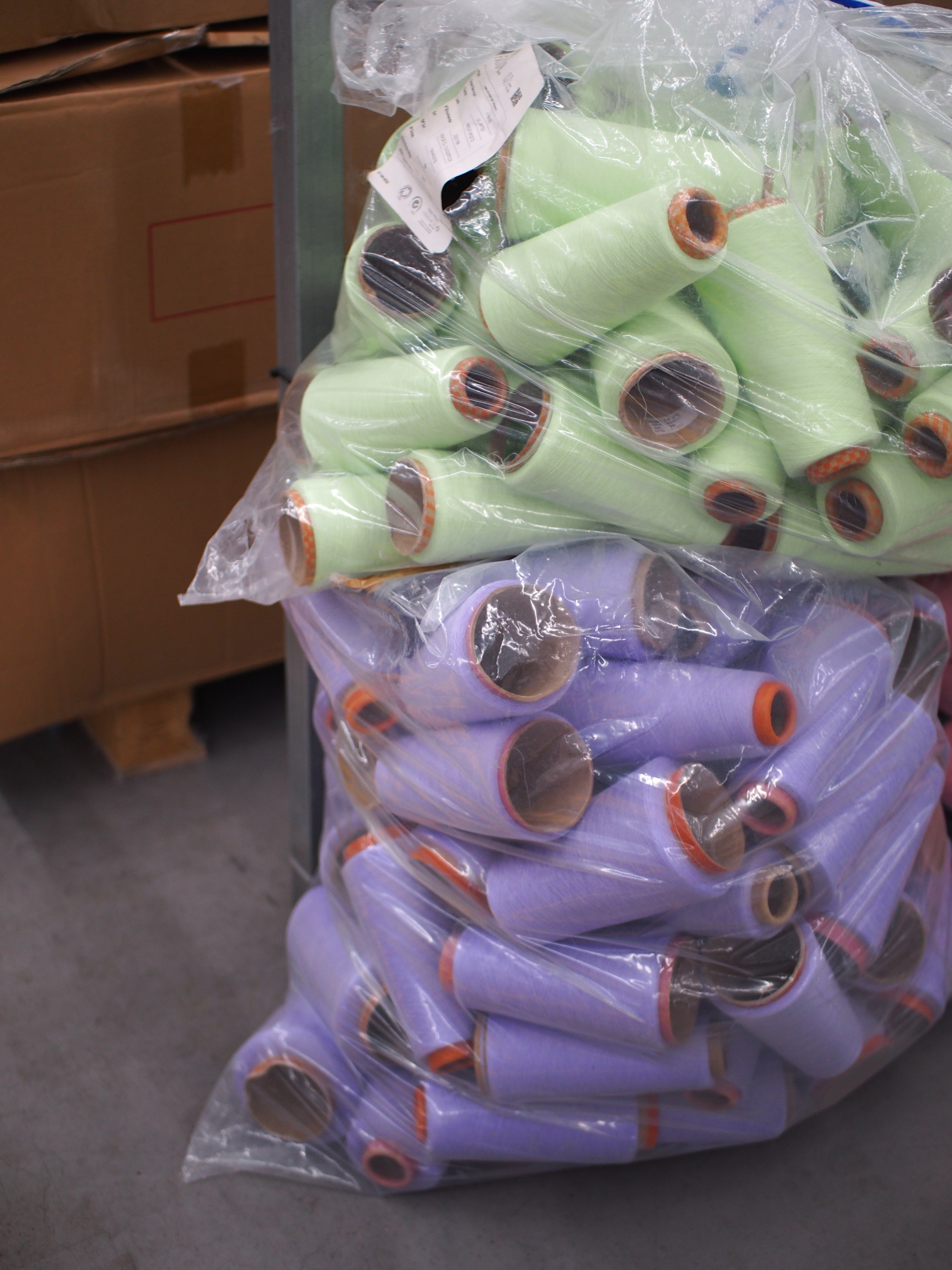 Yarns in bright green and lavender waiting for embroidery.