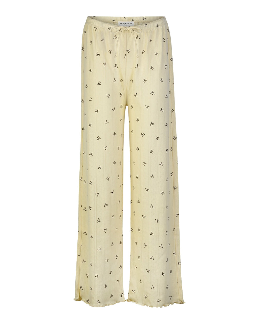 The jan-n-june POINTELLE PYJAMA PANTS BUTTERBOW GOTS are light yellow, wide-leg pants with a small floral pattern and elastic waistband, made from GOTS certified organic cotton, shown on a plain white background.