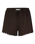 Jan-n-junes POINTELLE PYJAMA SHORTS CHOCOLATE GOTS are dark brown, loose-fitting organic cotton shorts featuring a drawstring waistband and ruffled hem, shown against a white background.