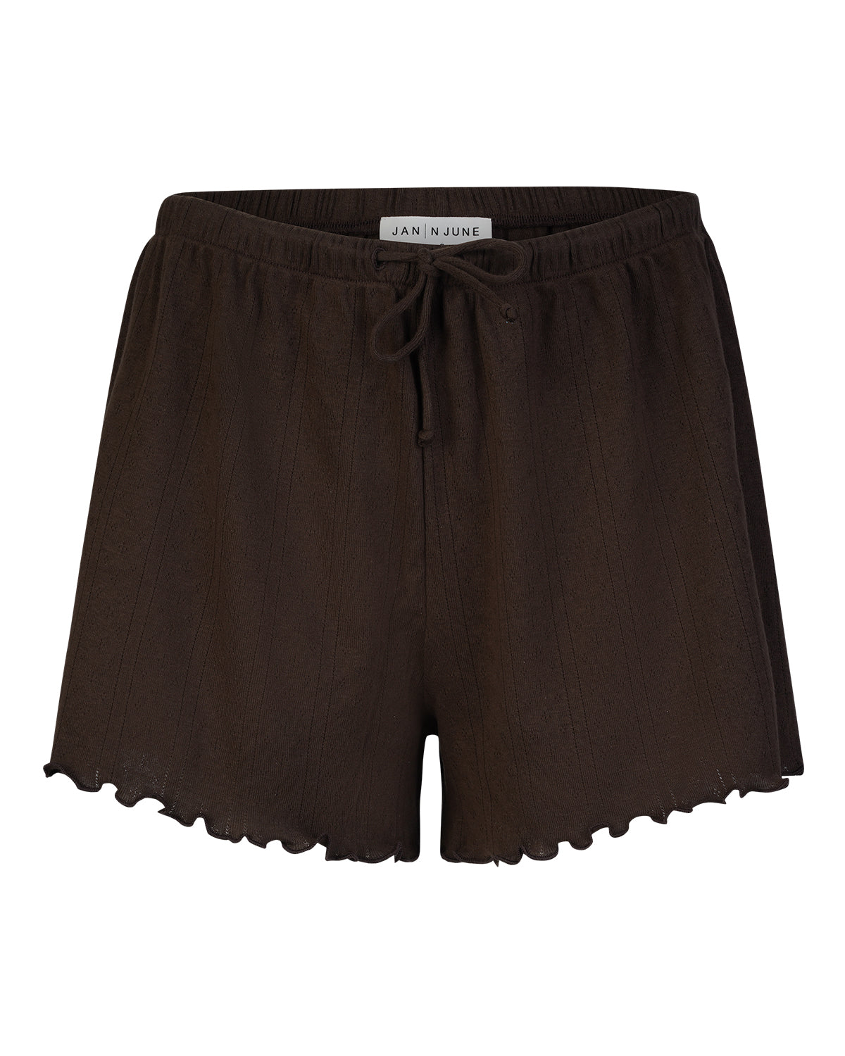 Jan-n-junes POINTELLE PYJAMA SHORTS CHOCOLATE GOTS are dark brown, loose-fitting organic cotton shorts featuring a drawstring waistband and ruffled hem, shown against a white background.