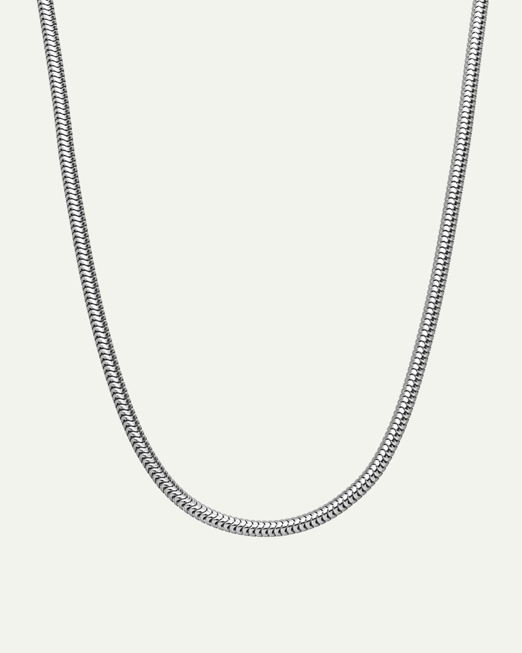 The jan-n-june DEAR DARLING BERLIN DELICATE SHORT SNAKE NECKLACE SILVER is a recycled 925 sterling silver necklace with a sleek snake chain design, shown on a plain white background.