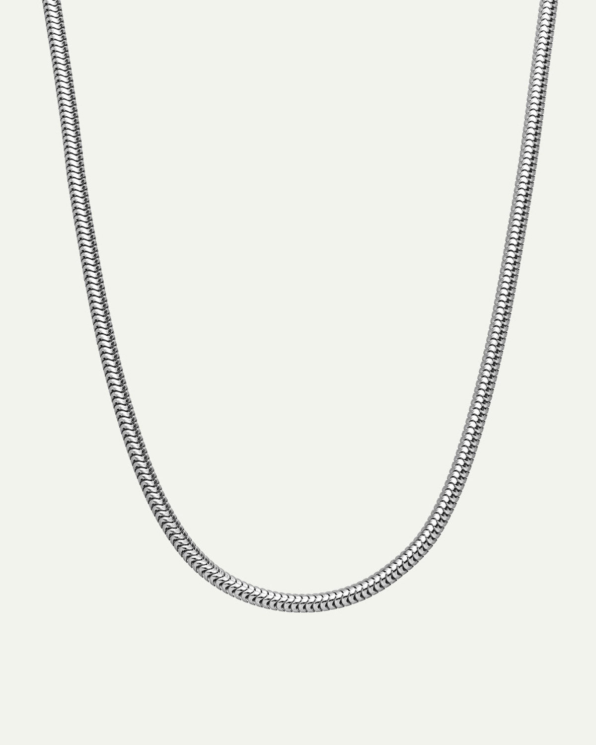 The jan-n-june DEAR DARLING BERLIN DELICATE SHORT SNAKE NECKLACE SILVER is a recycled 925 sterling silver necklace with a sleek snake chain design, shown on a plain white background.