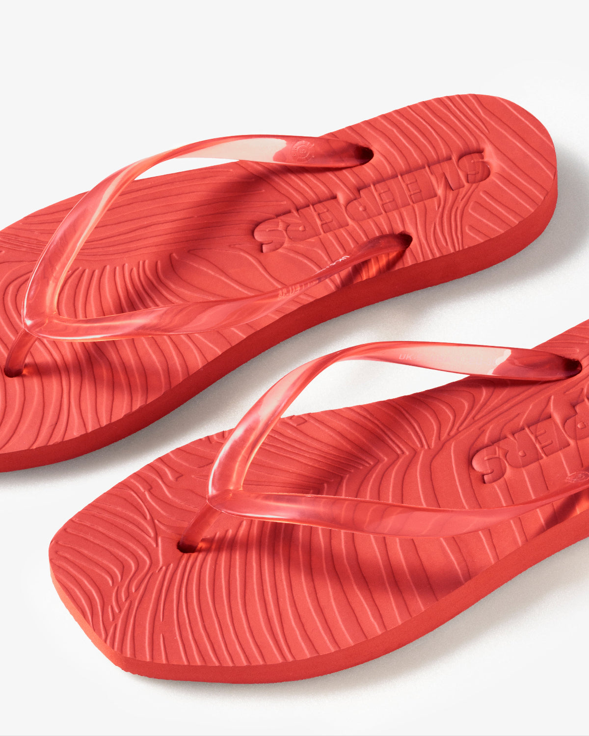 SLEEPERS TAPERED FLIP FLOPS TRANSPARENT RED