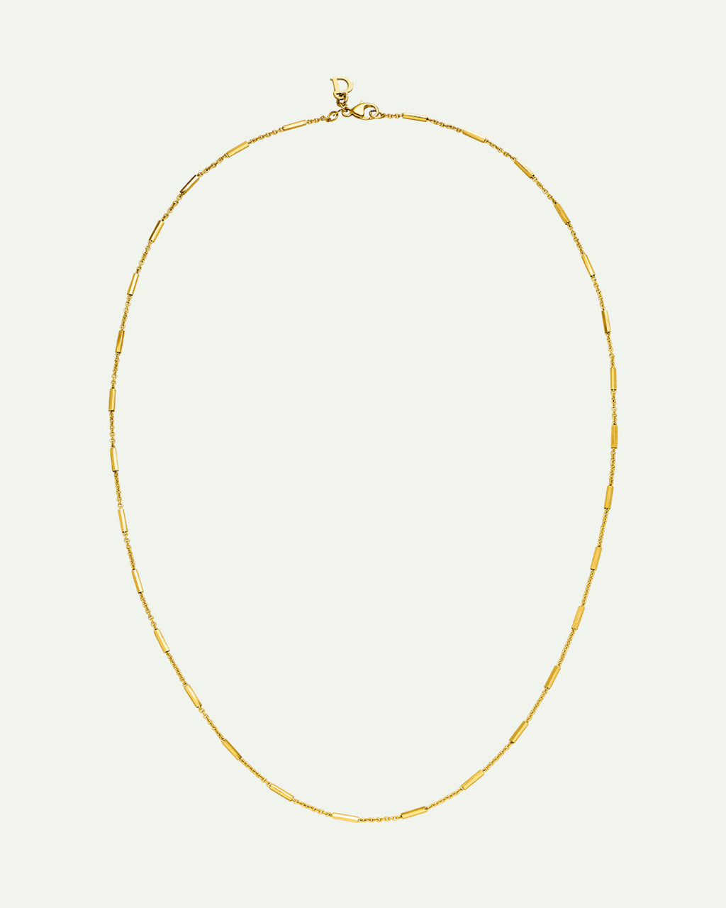 The jan-n-june DEAR DARLING BERLIN DELICATE NECKLACE WITH FINE BARS GOLD features small, evenly spaced bars on a recycled 925 Sterling Silver gold chain, displayed in an oval shape against a plain light background.