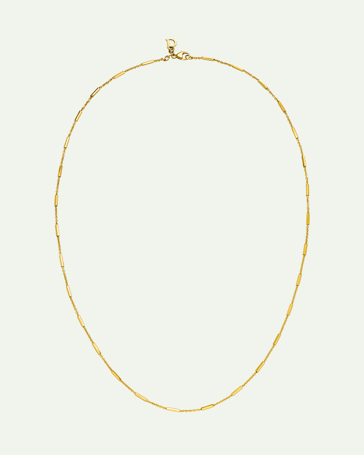 The jan-n-june DEAR DARLING BERLIN DELICATE NECKLACE WITH FINE BARS GOLD features small, evenly spaced bars on a recycled 925 Sterling Silver gold chain, displayed in an oval shape against a plain light background.