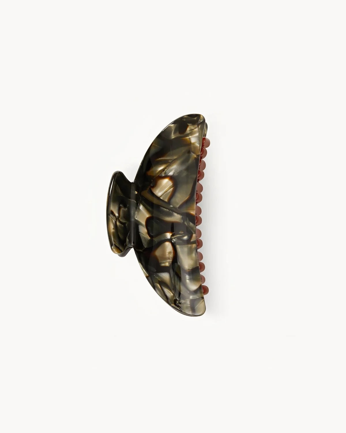 The MIDI HEIRLOOM CLAW MIDNIGHT HORN by jan-n-june features curved edges and brown teeth in a horn-patterned design, crafted in Italy for timeless style.