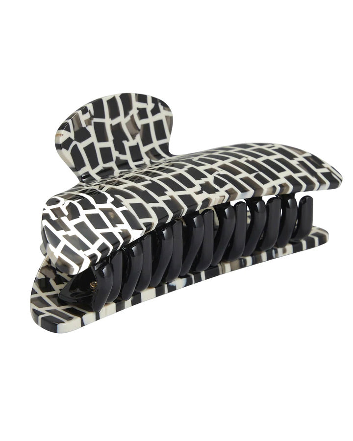 The jan-n-june MIDI HEIRLOOM CLAW TOKYO CHECKER is a large rectangular hair clip featuring a black and white geometric pattern and black interlocking teeth, shown on a white background.